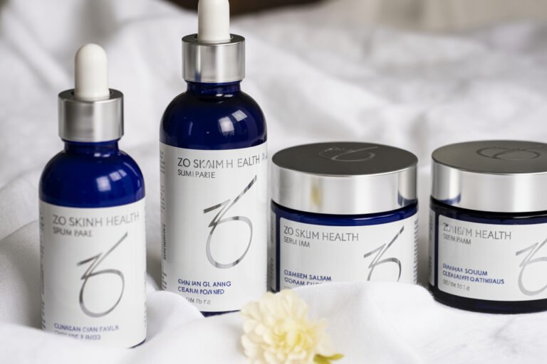 ZO Skin Health ,Close-up of ZO Skin Health skincare products arranged on white background with serum bottles and cream jars showing medical-grade formulations